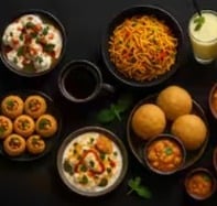 A spread of Ruva chaat, pani puri, noodles and drinks